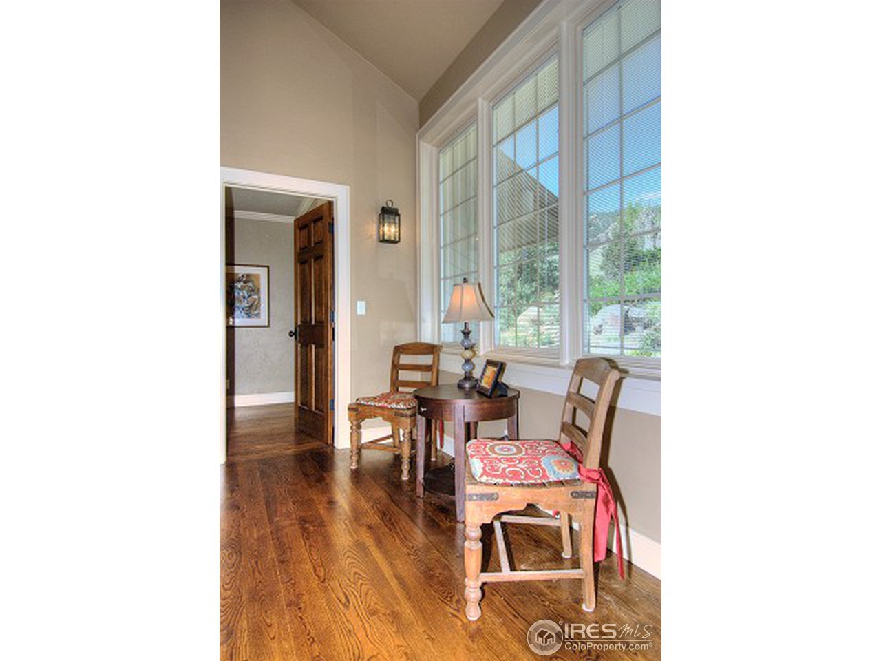 3850 Spring Valley Road Boulder, CO 80304 - Photo 13 of 25 a dining room with furniture and wooden floor
