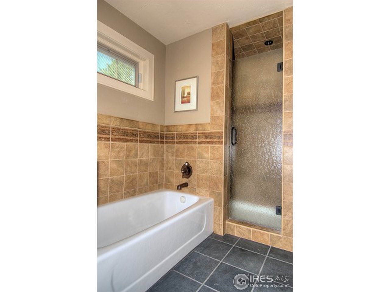 3850 Spring Valley Road Boulder, CO 80304 - Photo 16 of 25 a bathroom with a bathtub and a shower