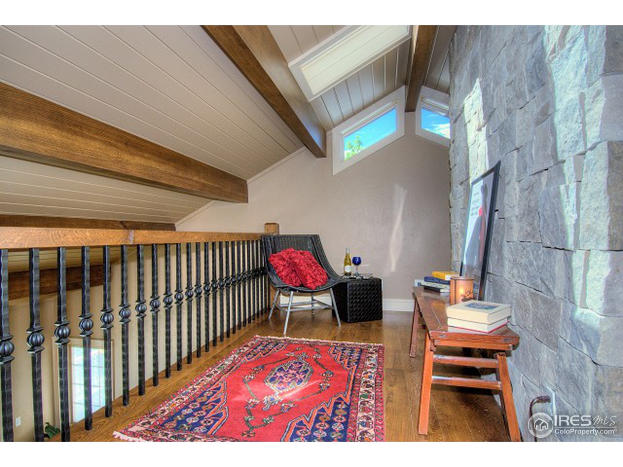 3850 Spring Valley Road Boulder, CO 80304 - Photo 19 of 25 a living room with furniture and a rug