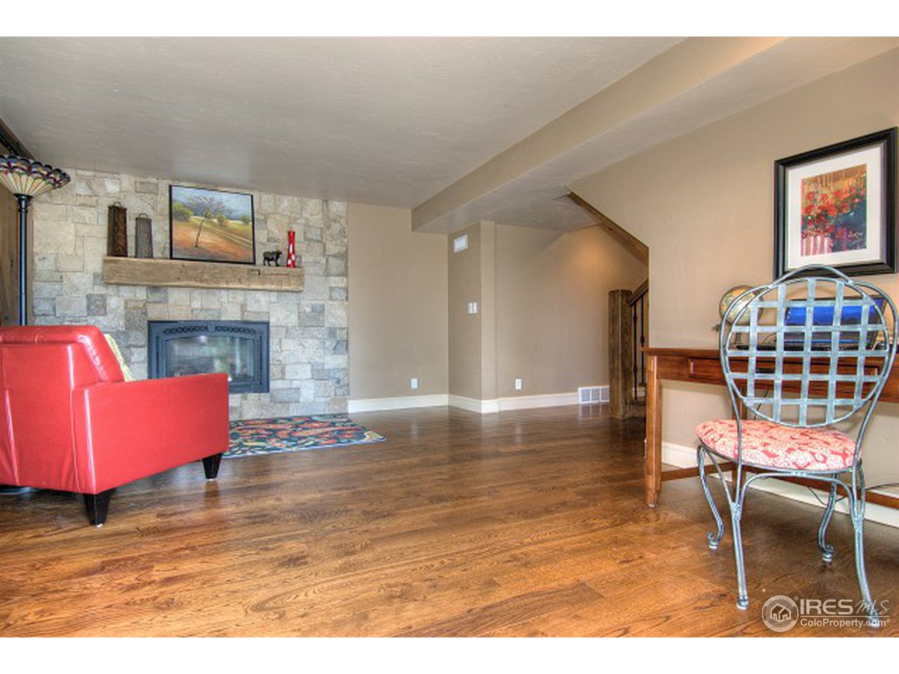 3850 Spring Valley Road Boulder, CO 80304 - Photo 20 of 25 a living room with furniture and a fireplace