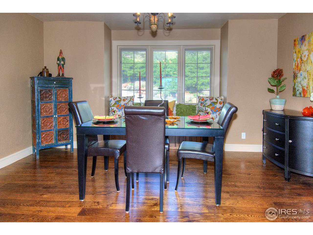 3850 Spring Valley Road Boulder, CO 80304 - Photo 3 of 25 a dining room with furniture and wooden floor