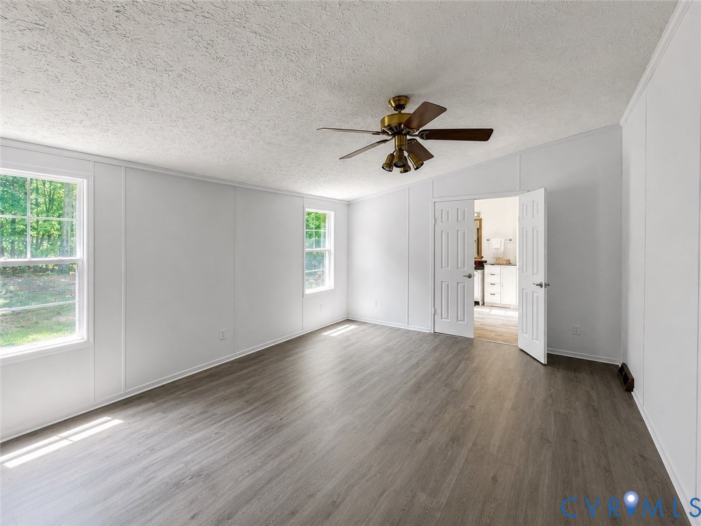 2229 Texas School Road Wingina, VA 24599 - Photo 13 of 22 Generous sized primary bedroom with ceiling fan, a