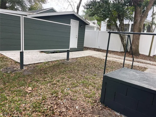 a view of house with yard