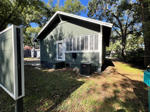 a view of a back yard of the house