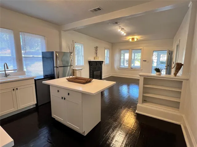 a view of a kitchen counter space and a sink