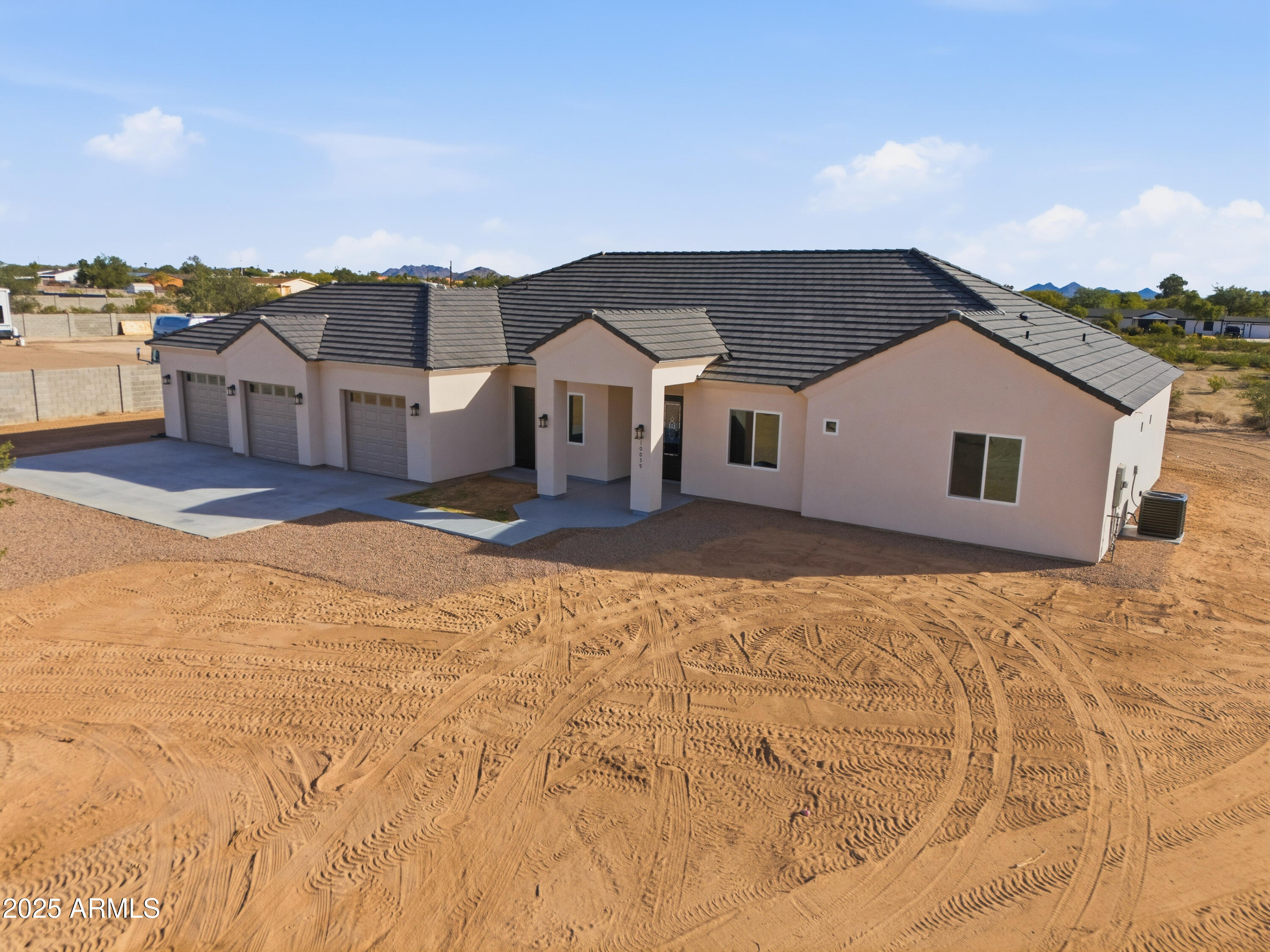 10039 North Burris Road Casa Grande, AZ 85122 - Photo 12 of 61 a front view of a house with a yard