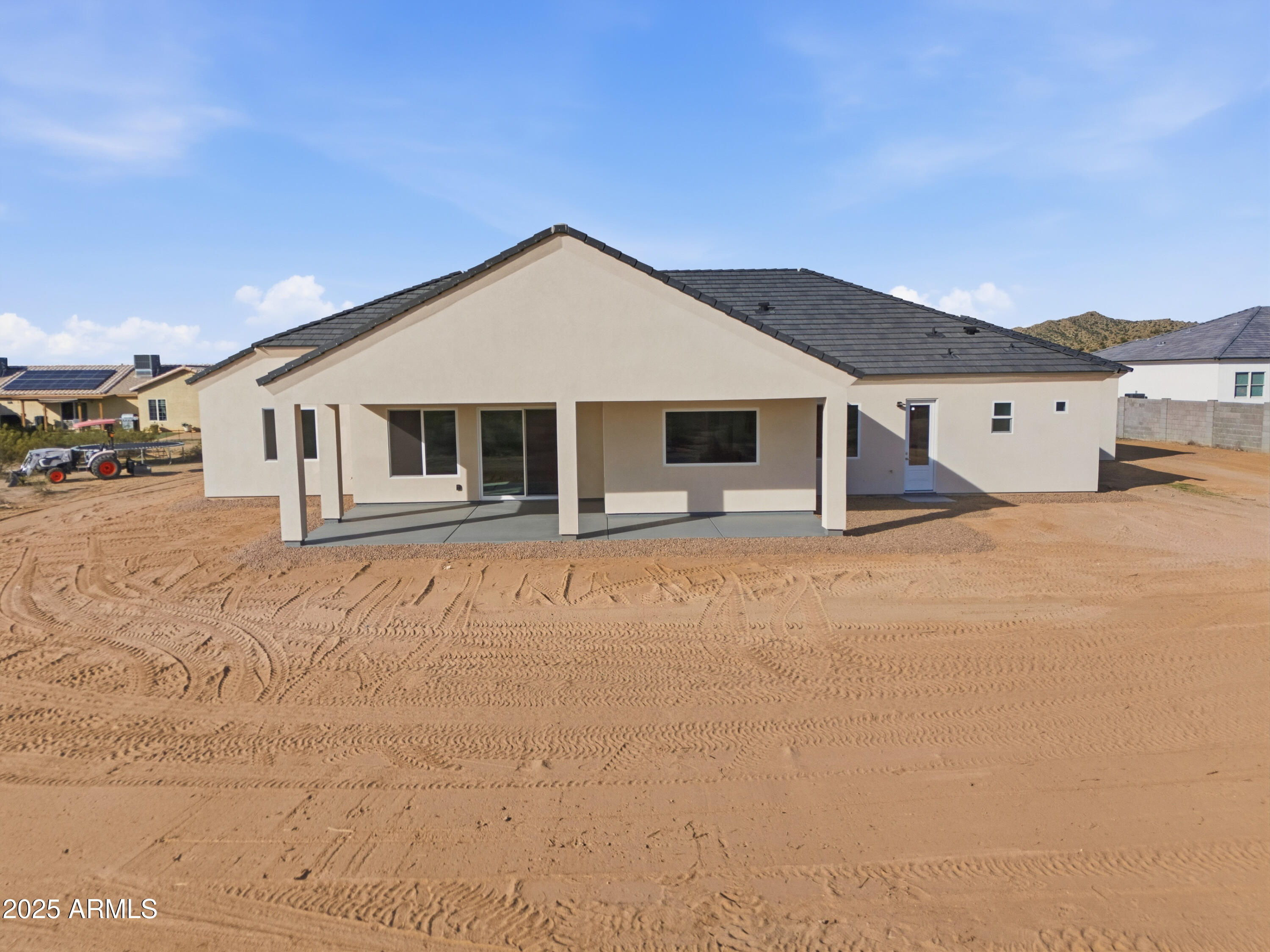 10039 North Burris Road Casa Grande, AZ 85122 - Photo 18 of 61 a front view of a house with a yard