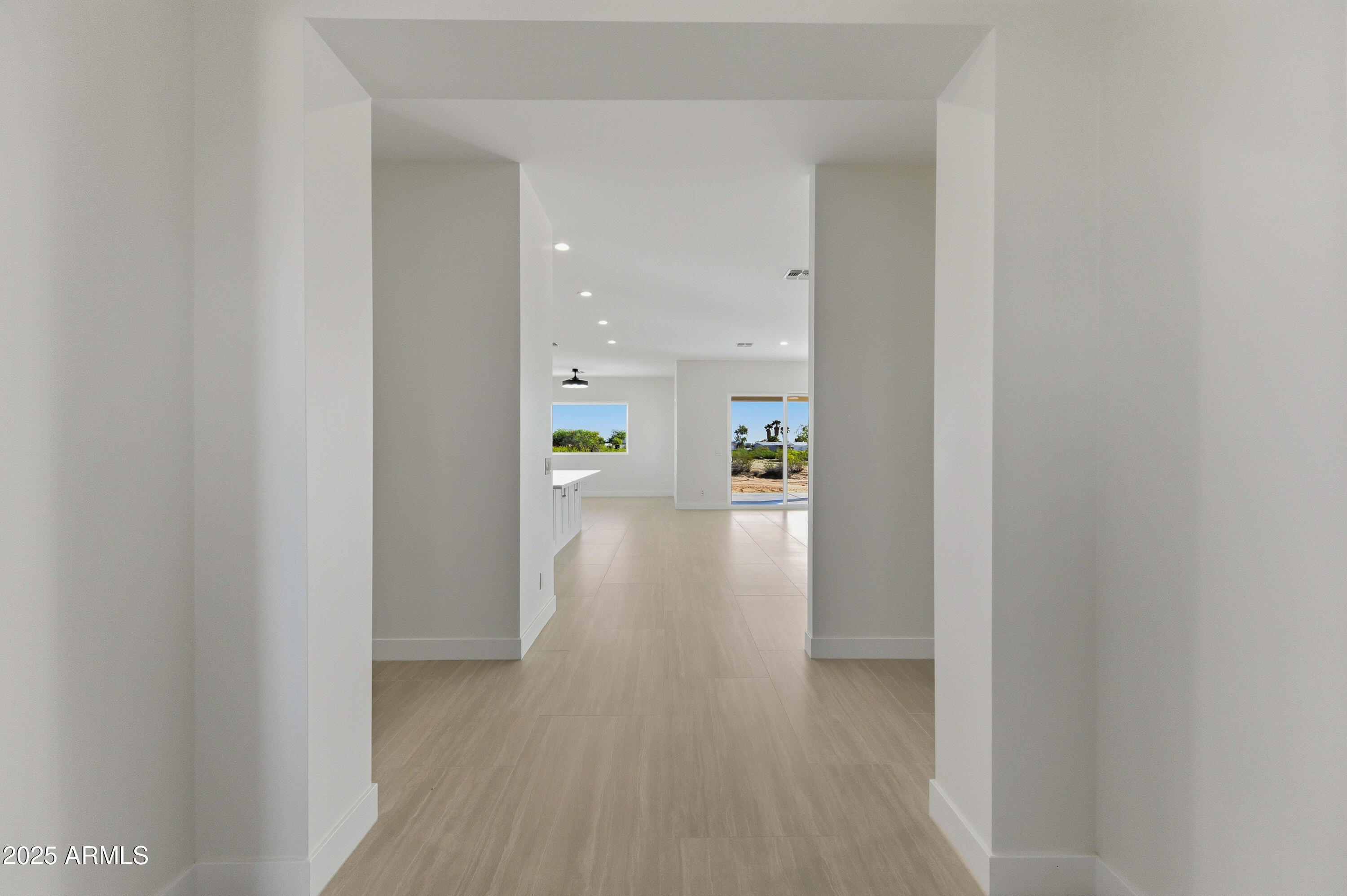 10039 North Burris Road Casa Grande, AZ 85122 - Photo 24 of 61 a view of a hallway with wooden floor