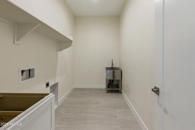 a bathroom with a double vanity sink a mirror and a bathtub