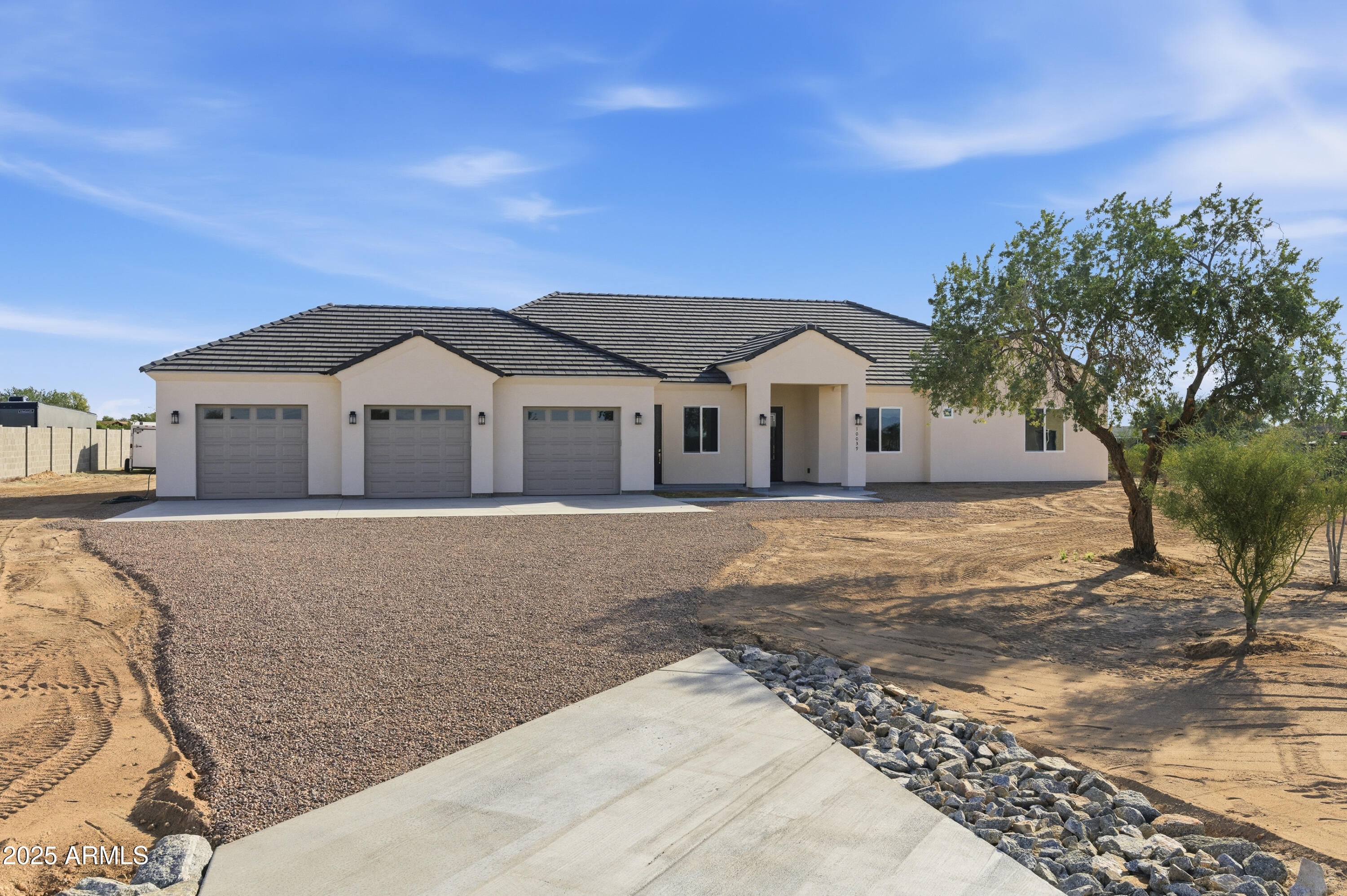 10039 North Burris Road Casa Grande, AZ 85122 - Photo 2 of 61 a front view of a house with a yard