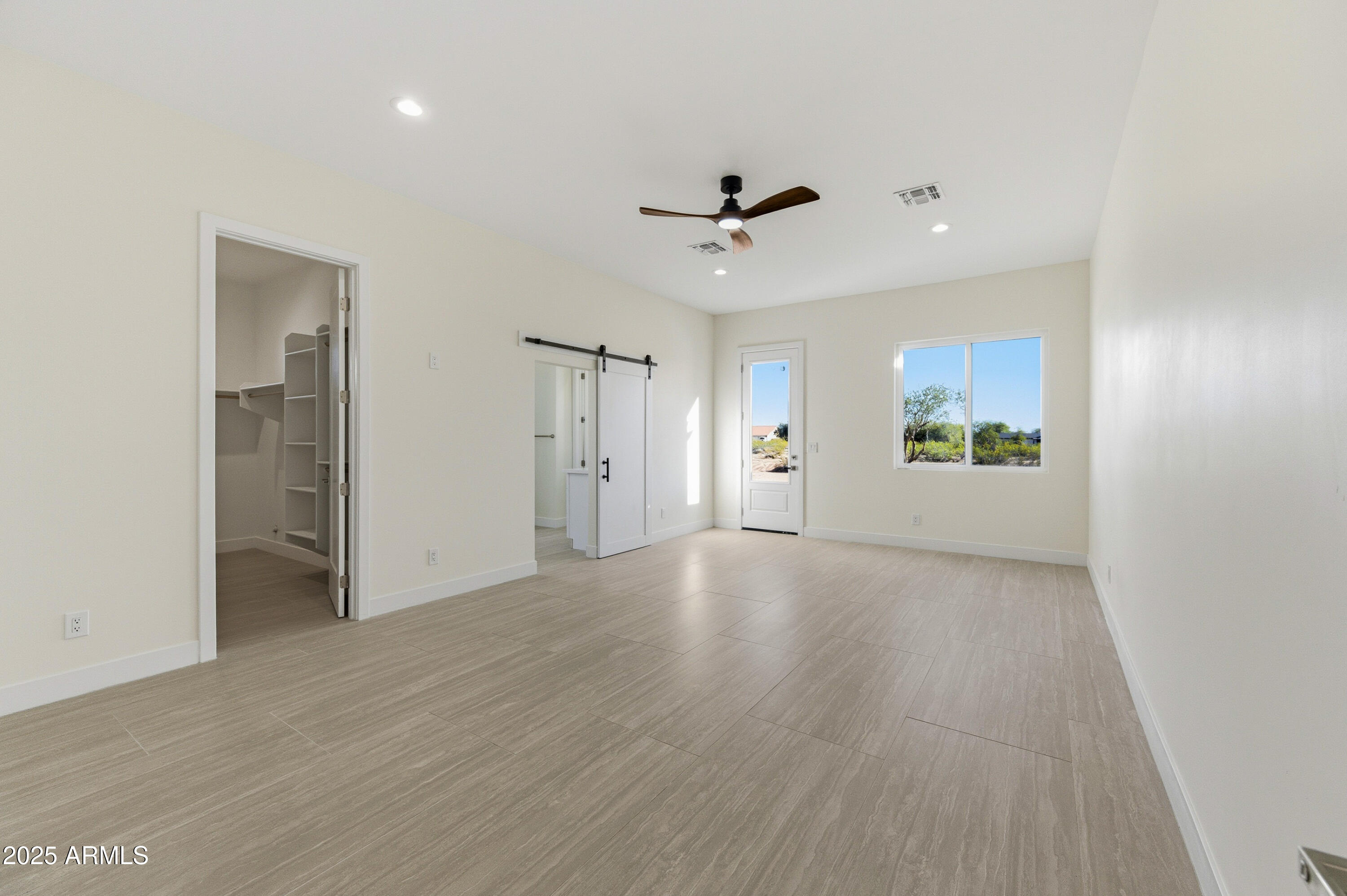 10039 North Burris Road Casa Grande, AZ 85122 - Photo 30 of 61 a view of an empty room with a window and a kitchen