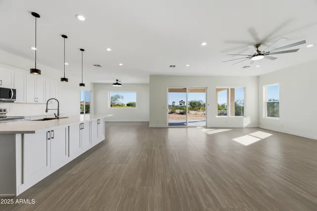 a view of a kitchen with a sink and a window