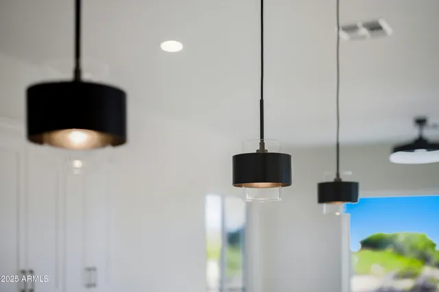a large white kitchen with a large window