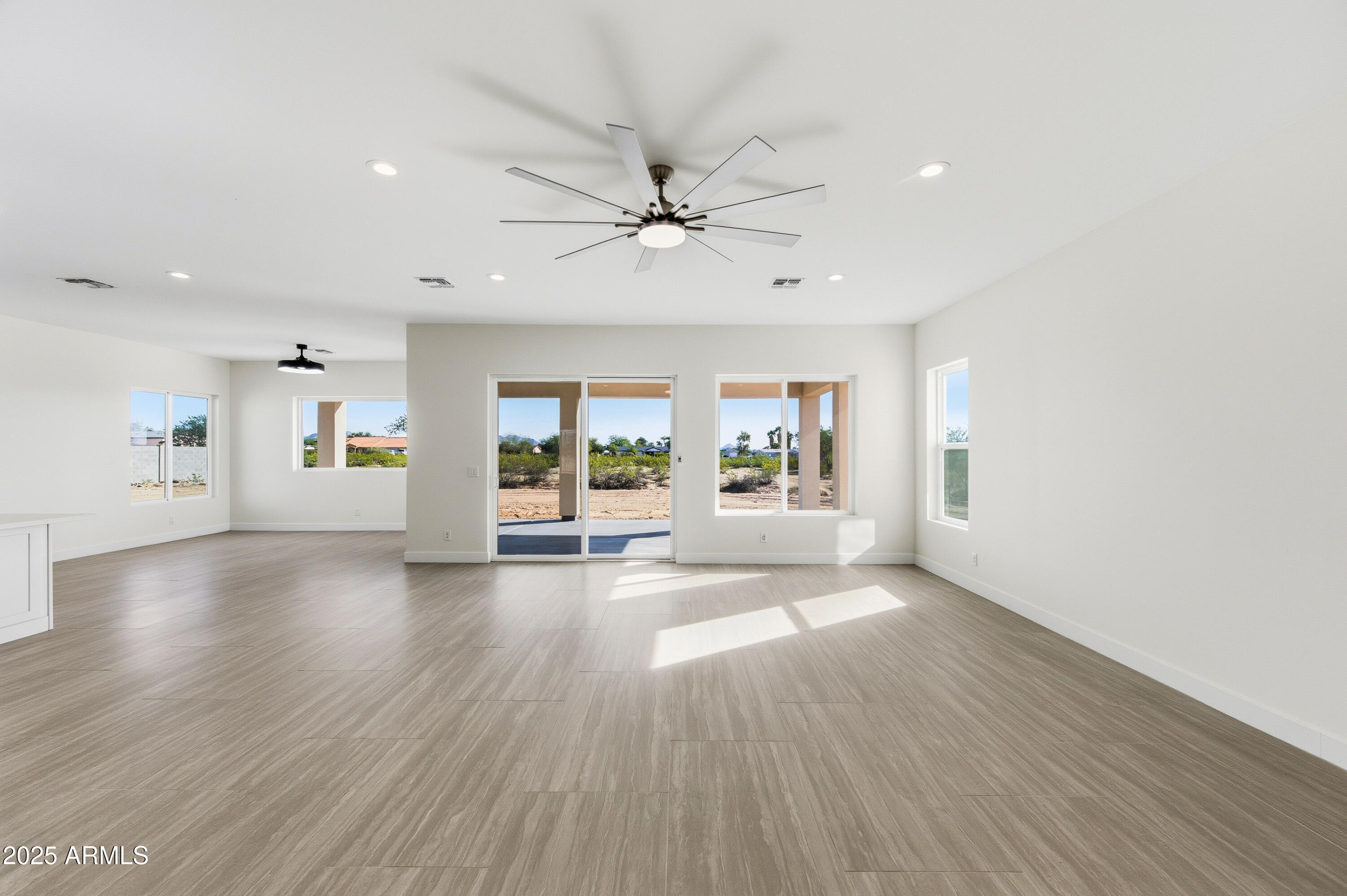 10039 North Burris Road Casa Grande, AZ 85122 - Photo 46 of 61 a view of an empty room with window and wooden floor