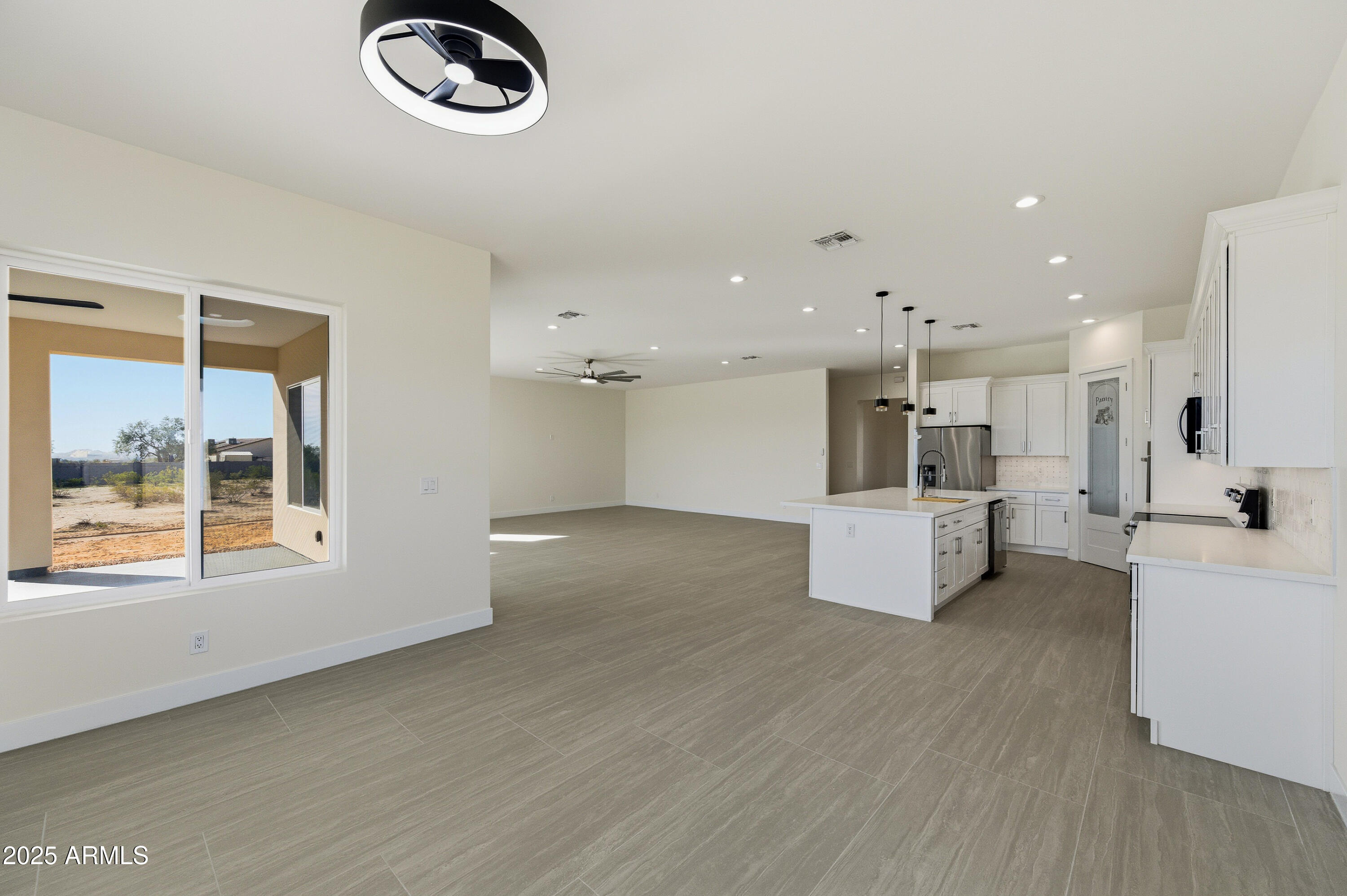 10039 North Burris Road Casa Grande, AZ 85122 - Photo 50 of 61 a large white kitchen with a large window