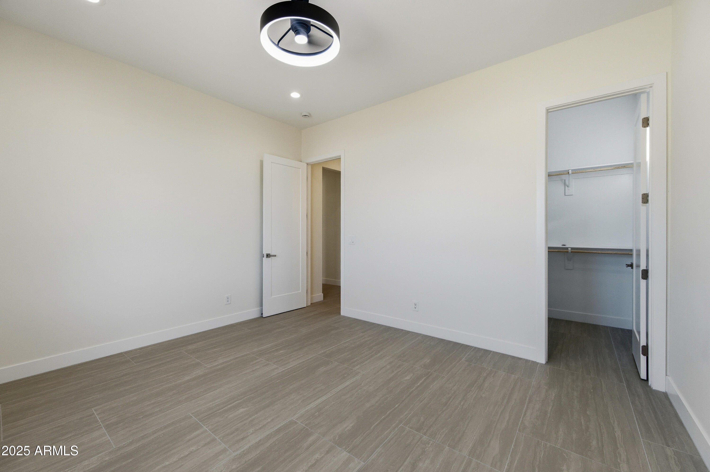 10039 North Burris Road Casa Grande, AZ 85122 - Photo 55 of 61 an empty room with wooden floor and mirror