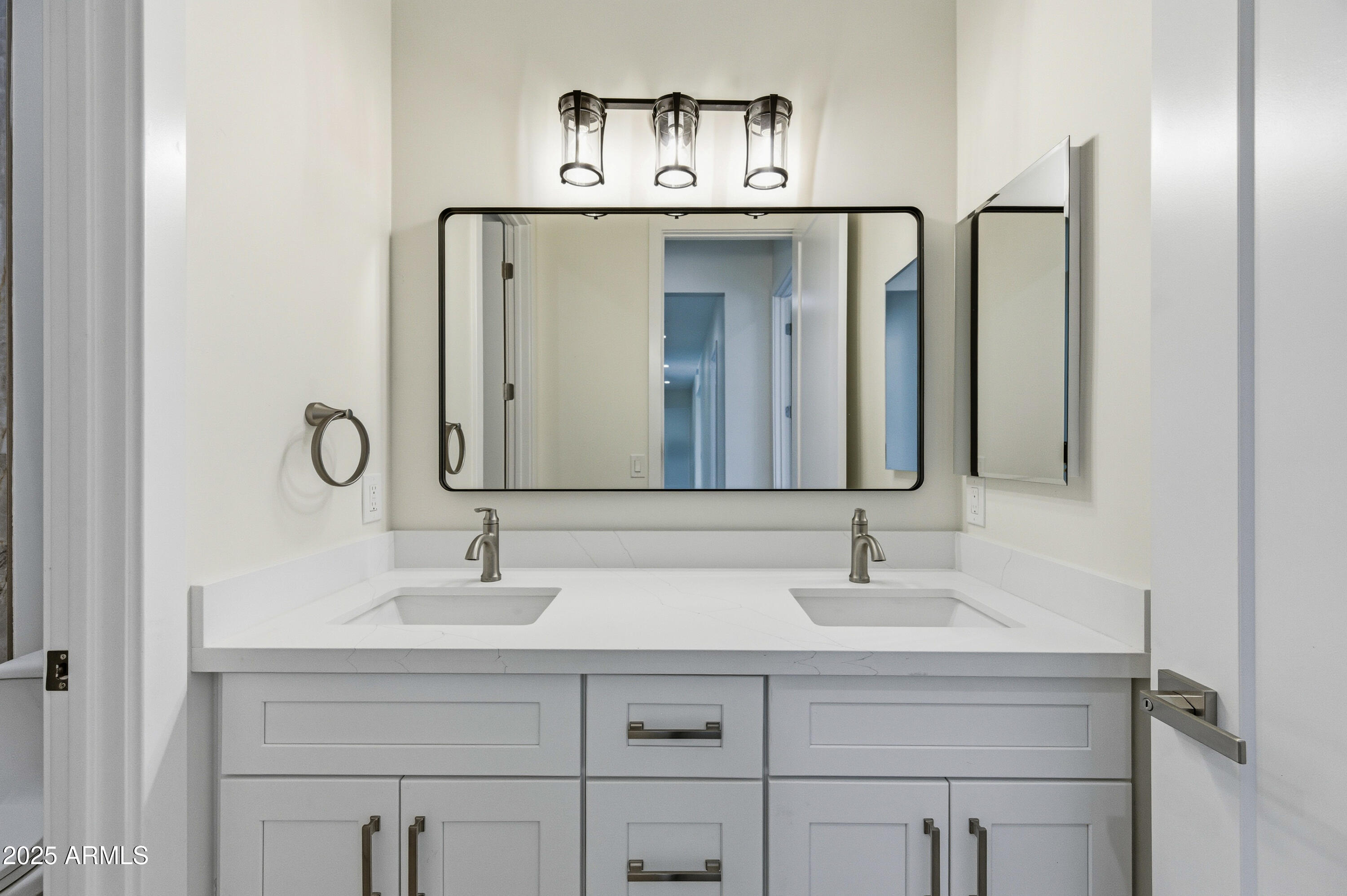 10039 North Burris Road Casa Grande, AZ 85122 - Photo 56 of 61 a bathroom with a sink and a mirror