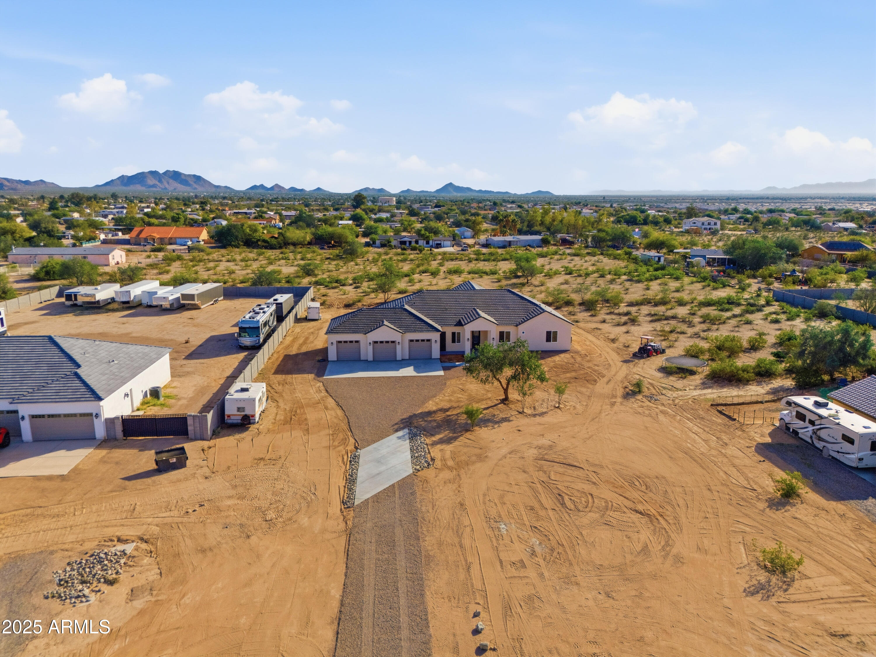 10039 North Burris Road Casa Grande, AZ 85122 - Photo 9 of 61 an aerial view of a house with a garden and lake view