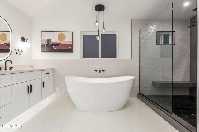 a large kitchen with a table and chairs