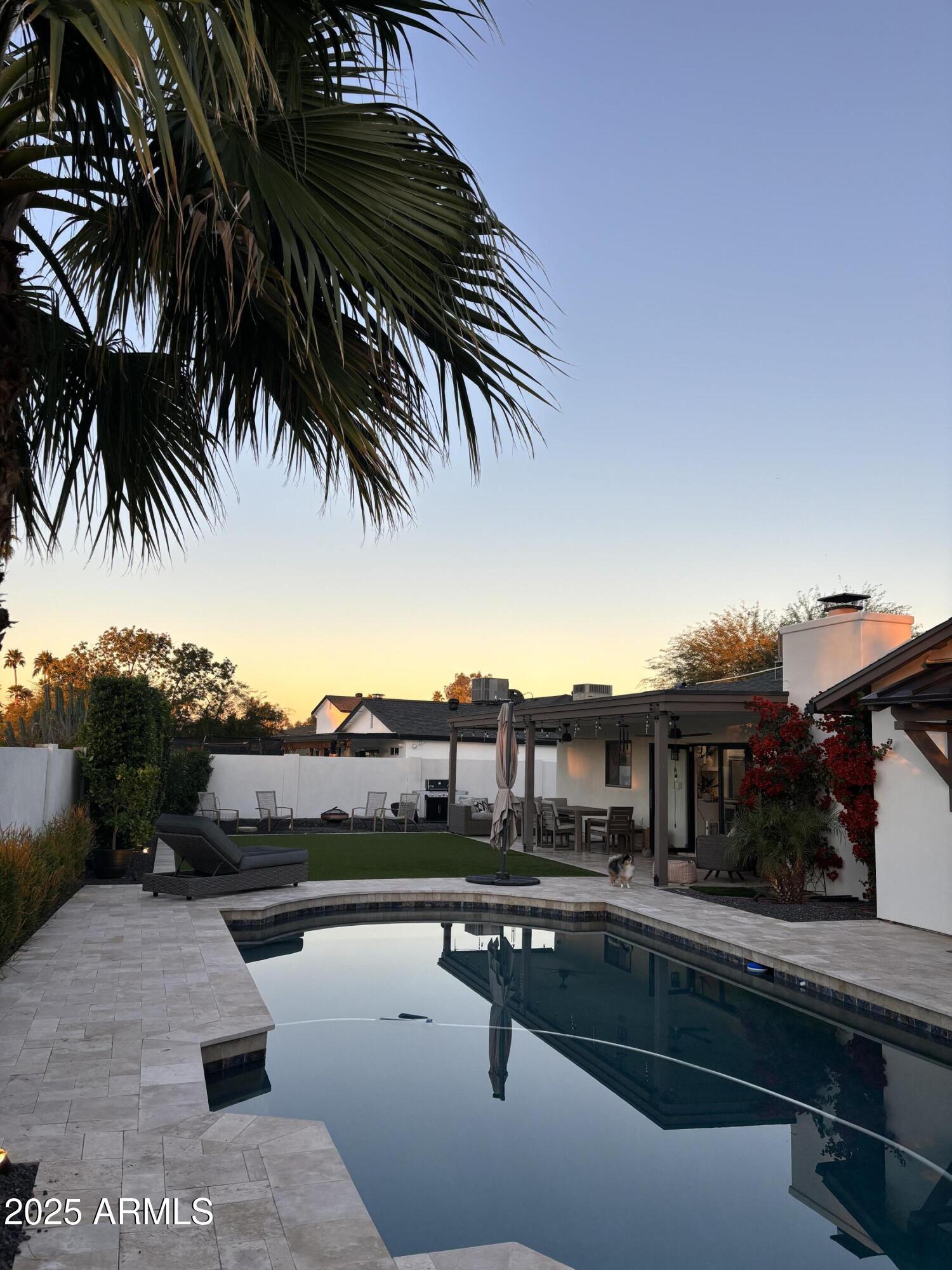 6533 East Phelps Road Scottsdale, AZ 85254 - Photo 5 of 6 a swimming pool with outdoor seating and yard