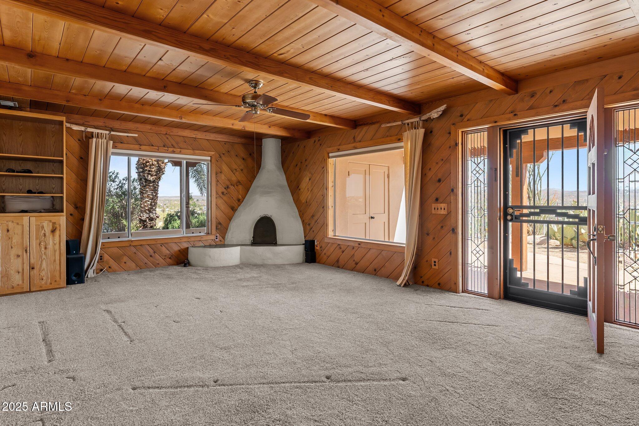 651 Chaparral Road Wickenburg, AZ 85390 - Photo 16 of 58 a view of an empty room with a fireplace