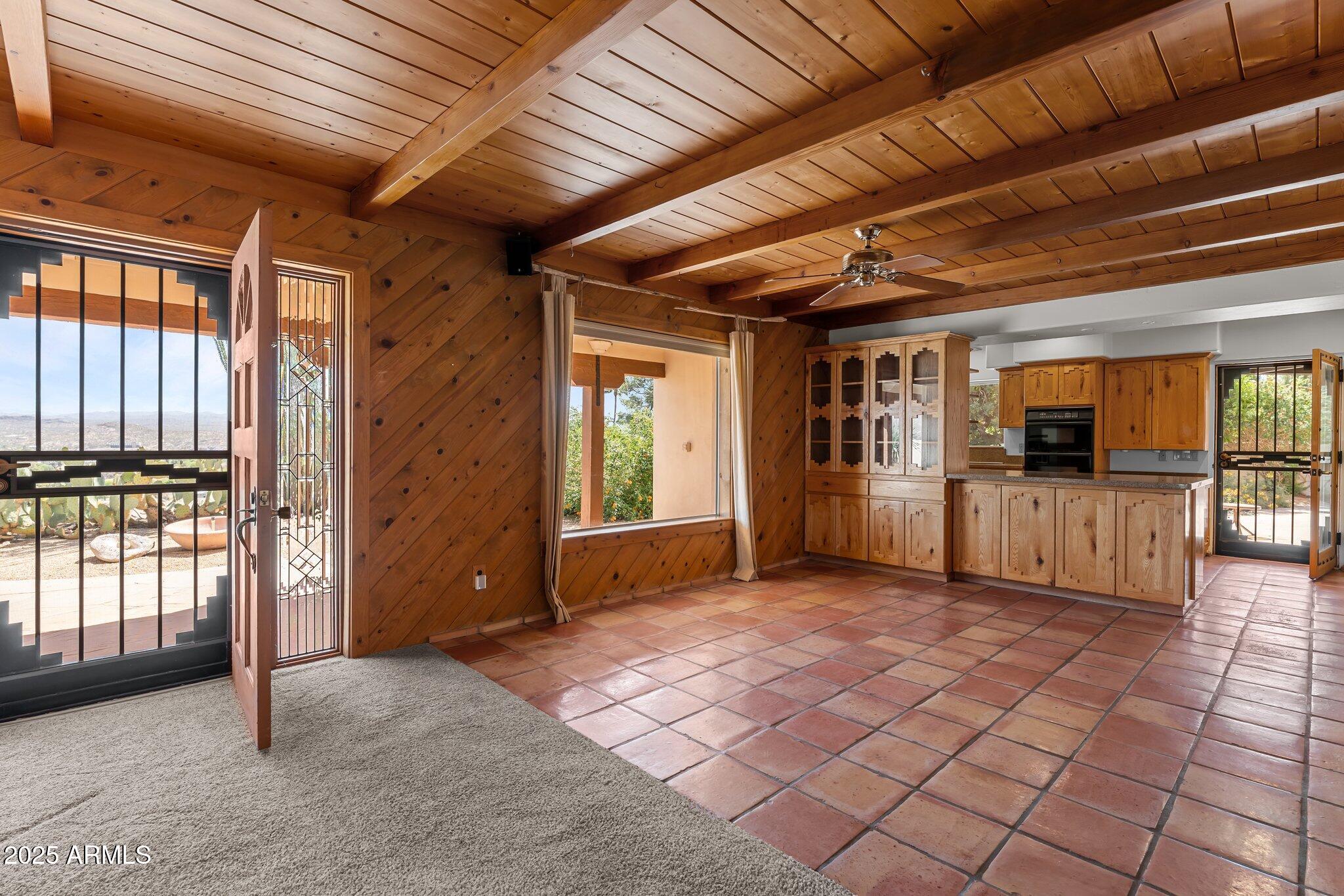 651 Chaparral Road Wickenburg, AZ 85390 - Photo 19 of 58 a view of livingroom with an empty space and wooden floor