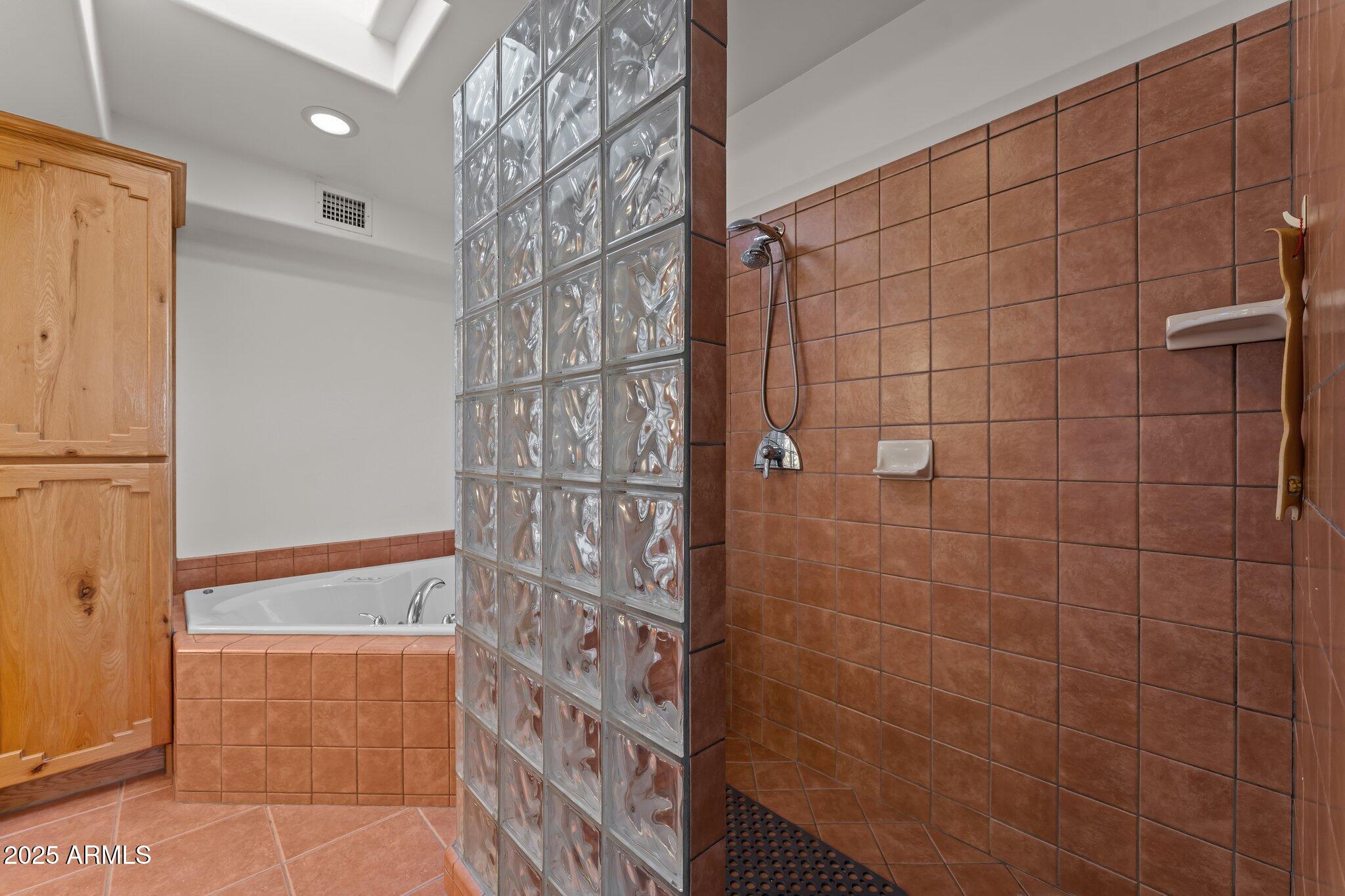 651 Chaparral Road Wickenburg, AZ 85390 - Photo 32 of 58 a bathroom with a shower