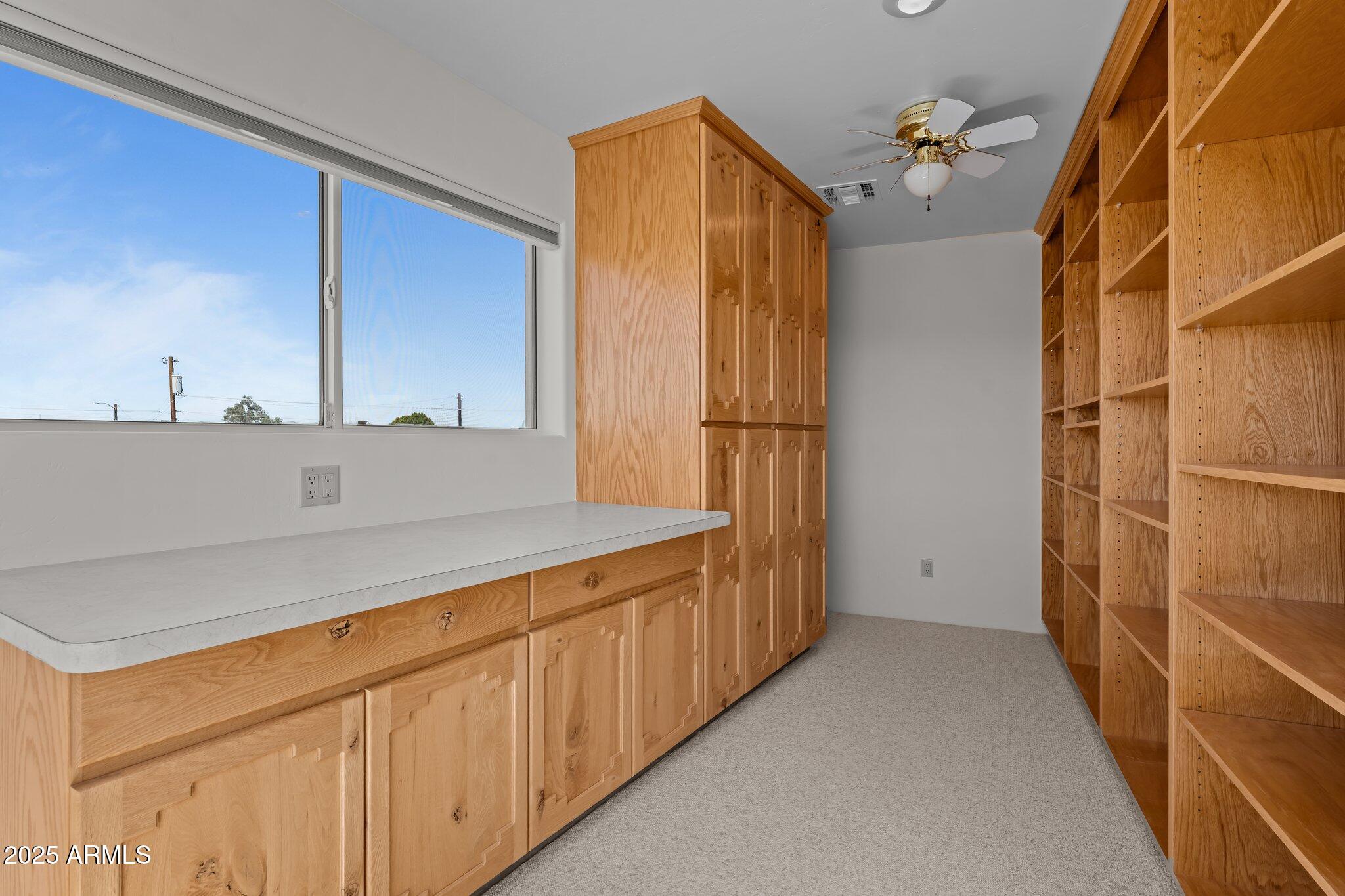 651 Chaparral Road Wickenburg, AZ 85390 - Photo 44 of 58 a bathroom with a double vanity sink and mirror