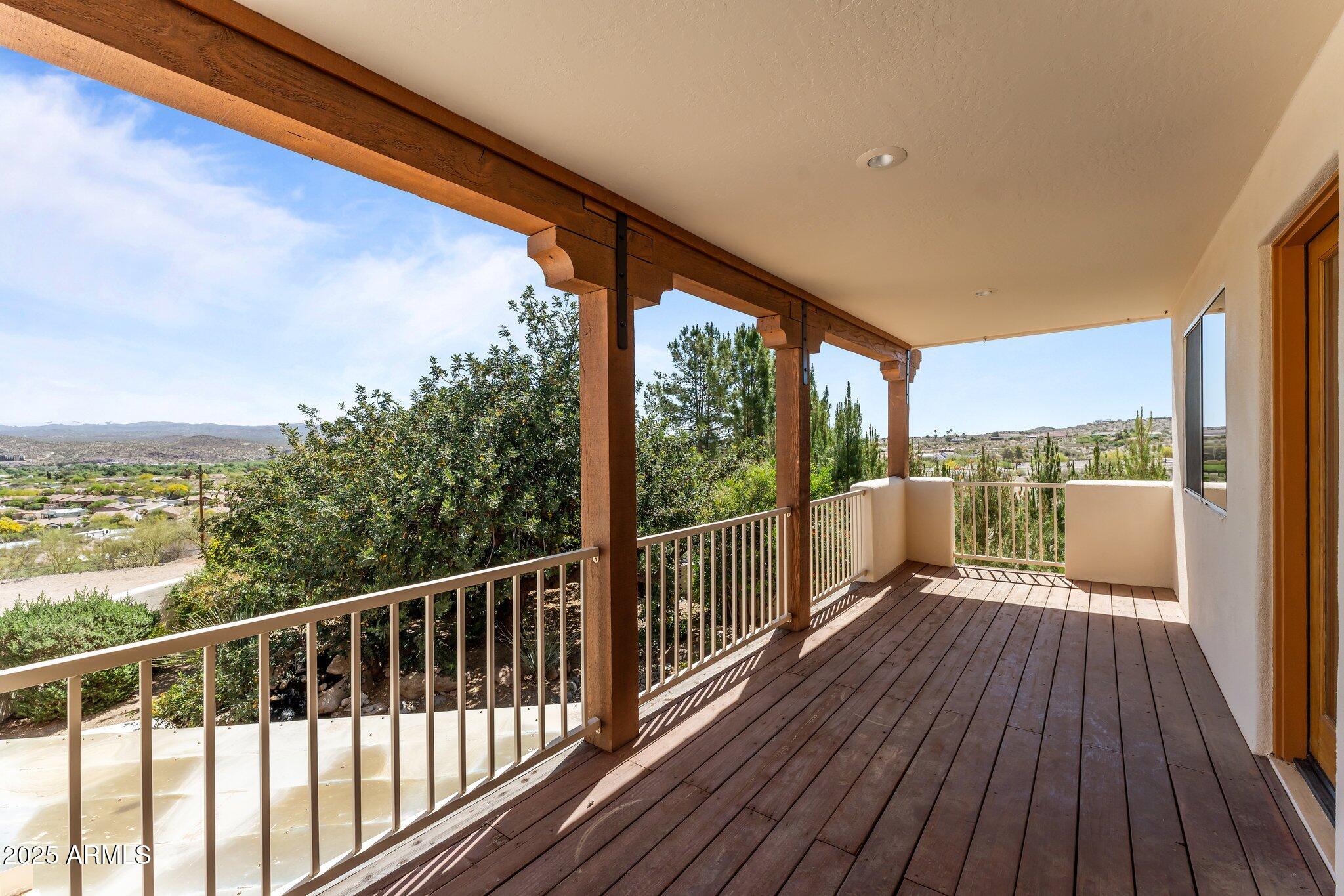 651 Chaparral Road Wickenburg, AZ 85390 - Photo 46 of 58 a view of a balcony with wooden floor
