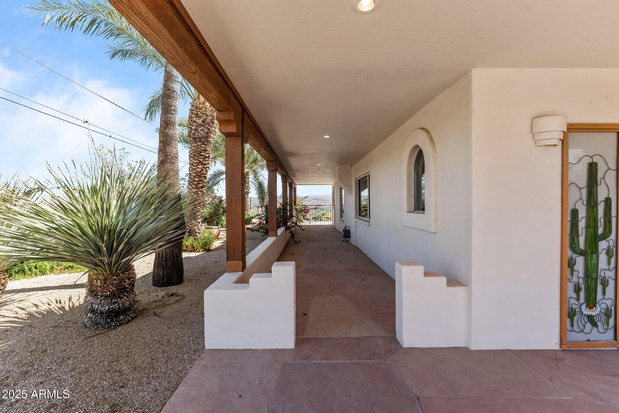 651 Chaparral Road Wickenburg, AZ 85390 - Photo 47 of 58 a living room with furniture and a potted plant