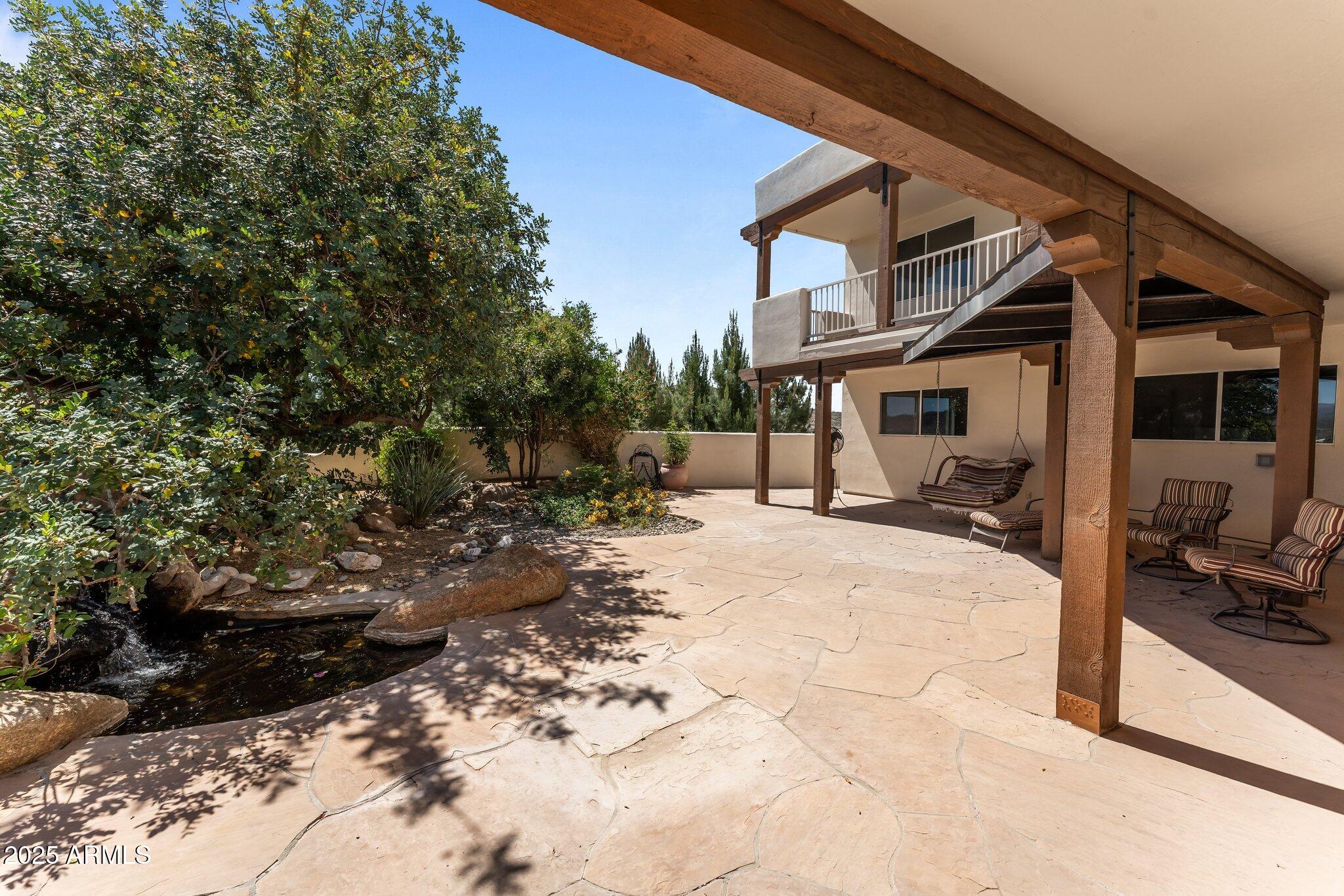 651 Chaparral Road Wickenburg, AZ 85390 - Photo 50 of 58 a view of a chairs and tables in the patio