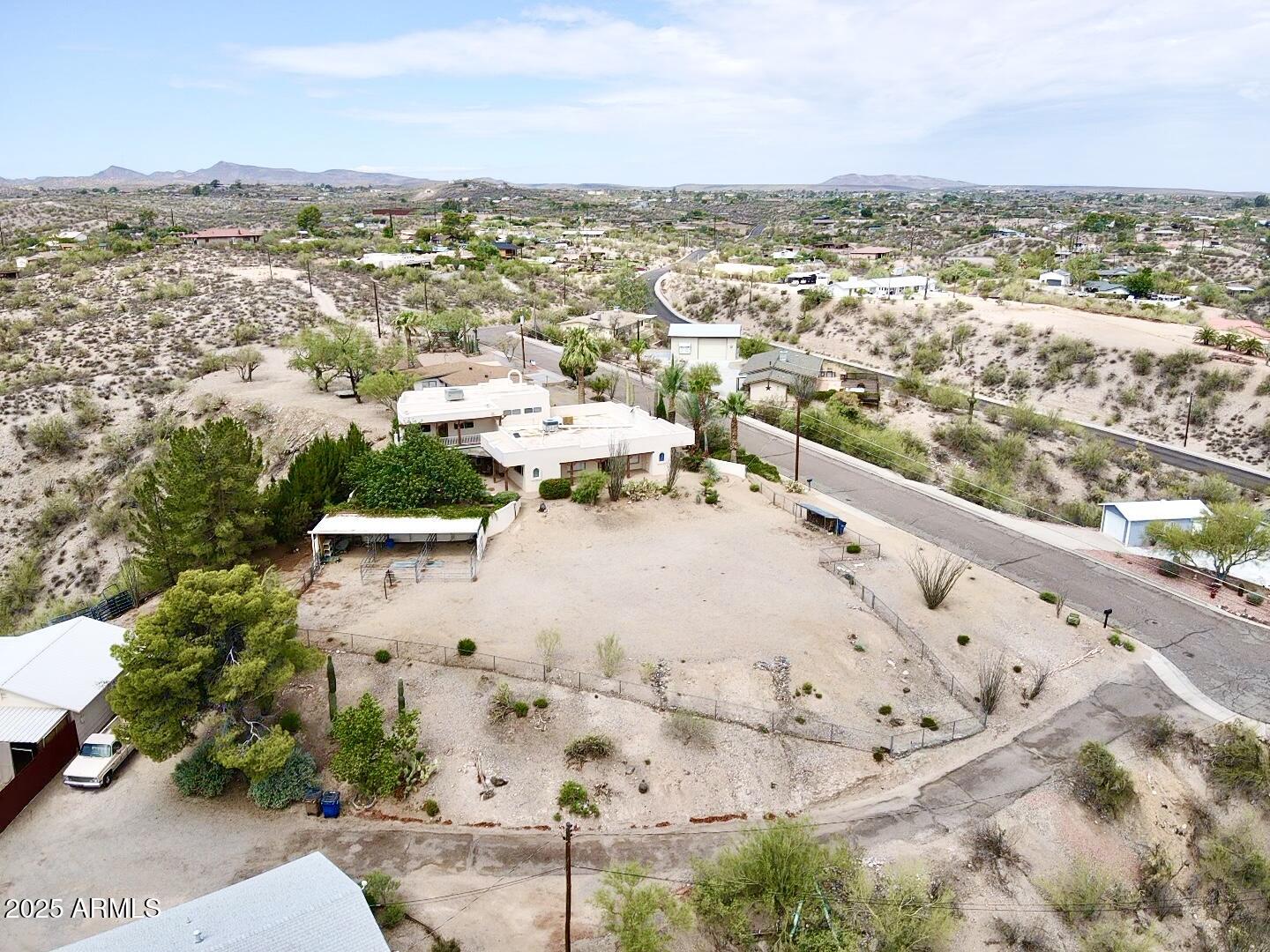 651 Chaparral Road Wickenburg, AZ 85390 - Photo 57 of 58 an aerial view of residential houses with outdoor space