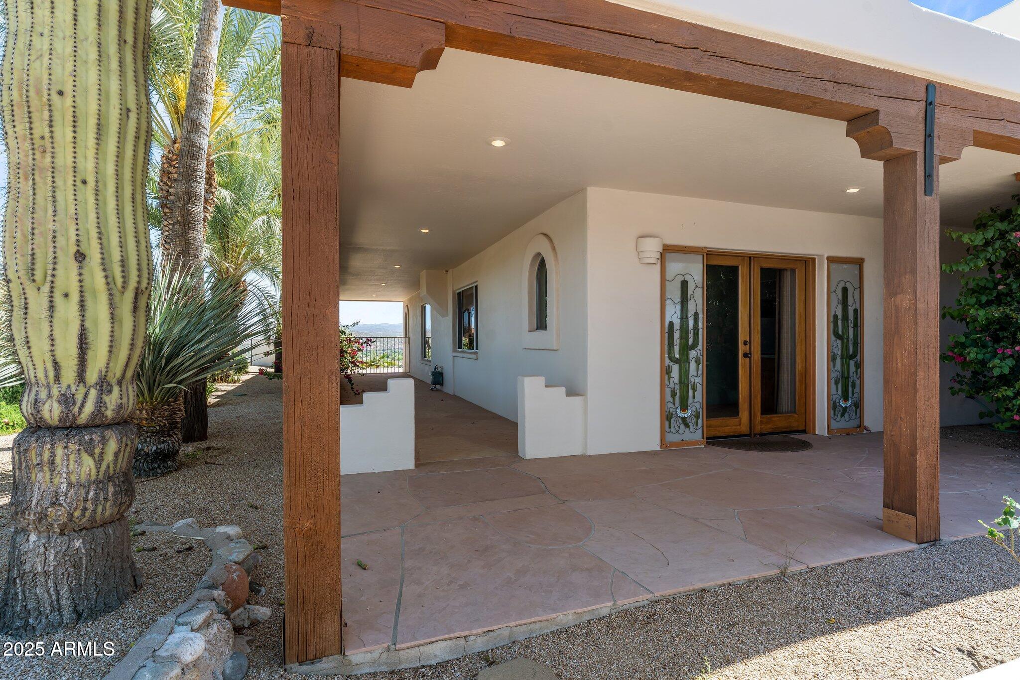 651 Chaparral Road Wickenburg, AZ 85390 - Photo 8 of 58 a view of a big room with wooden floor and a yard