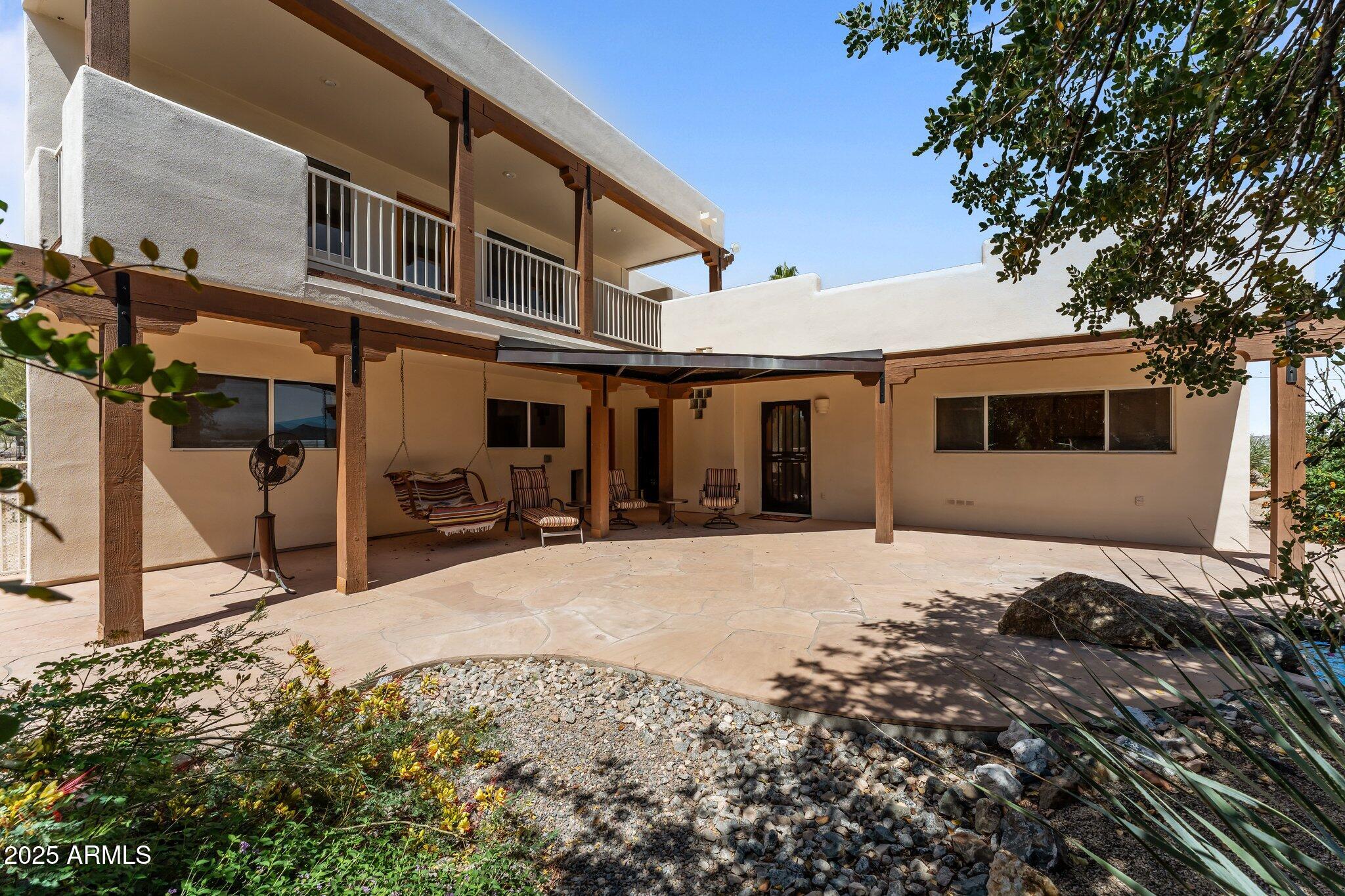 651 Chaparral Road Wickenburg, AZ 85390 - Photo 10 of 58 a front view of a house with a flat screen tv