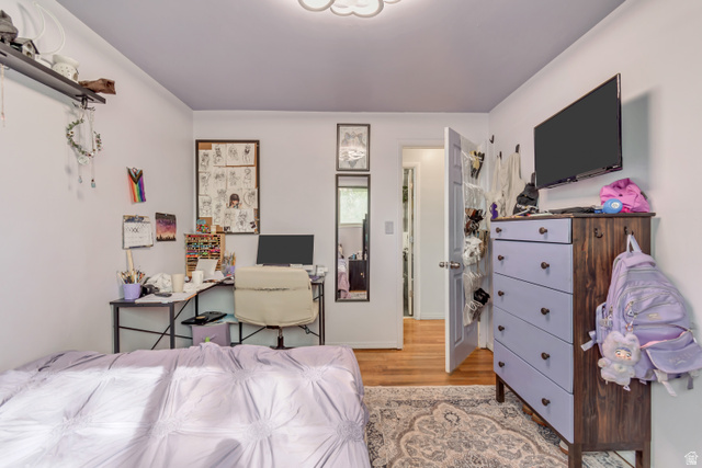 7470 Ramanee Drive Midvale, UT 84047 - Photo 18 of 29 Bedroom featuring light wood finished floors and a desk