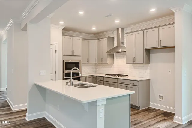 a view of a dining room with furniture and a window
