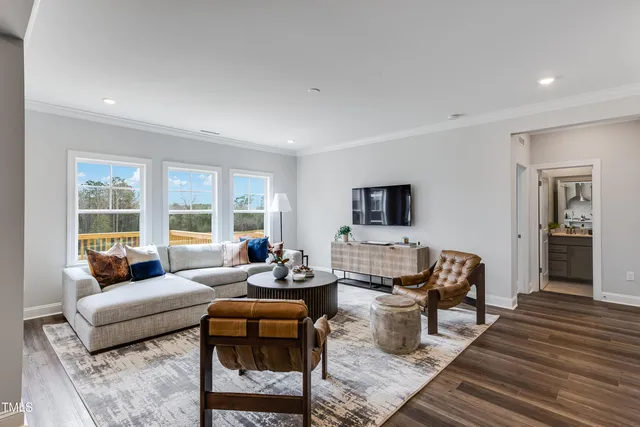 a bathroom with a sink a mirror a toilet and a shower