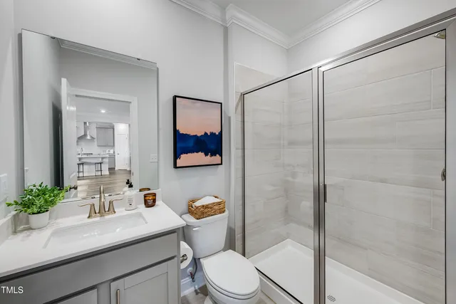 a spacious bathroom with a double vanity sink a mirror and a bathtub