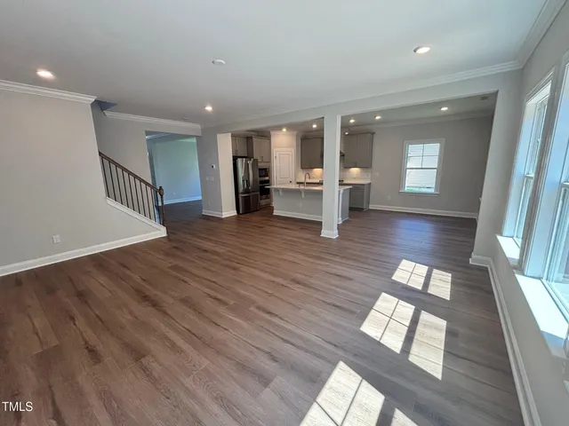 a view of an entryway with wooden floor and door