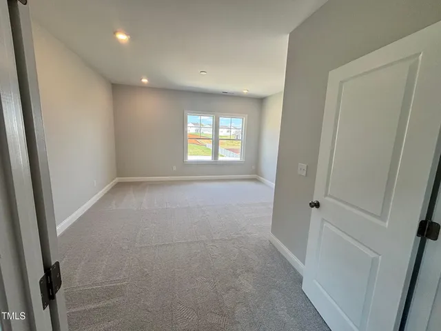 a view of balcony with wooden floor