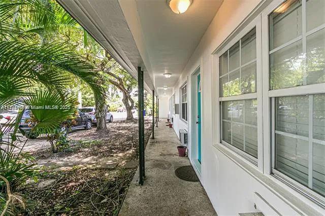 a view of a pathway of a house with backyard and garden
