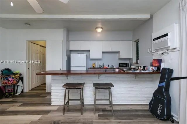 a kitchen with a sink cabinets and window