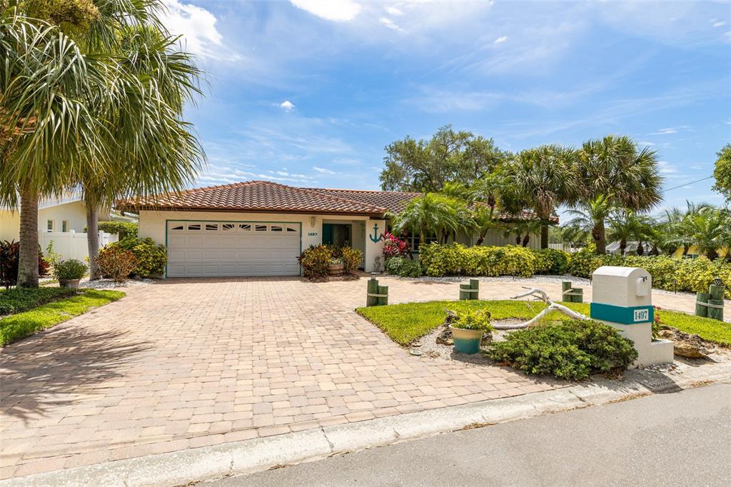a view of a house with swimming pool and a yard