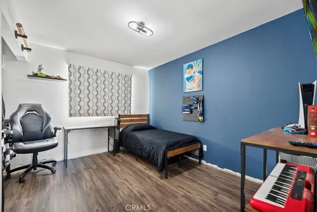 a living room with furniture and a piano