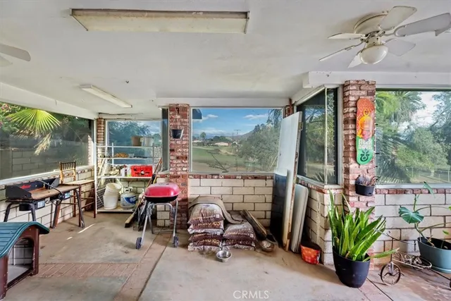 a room with furniture and garden view