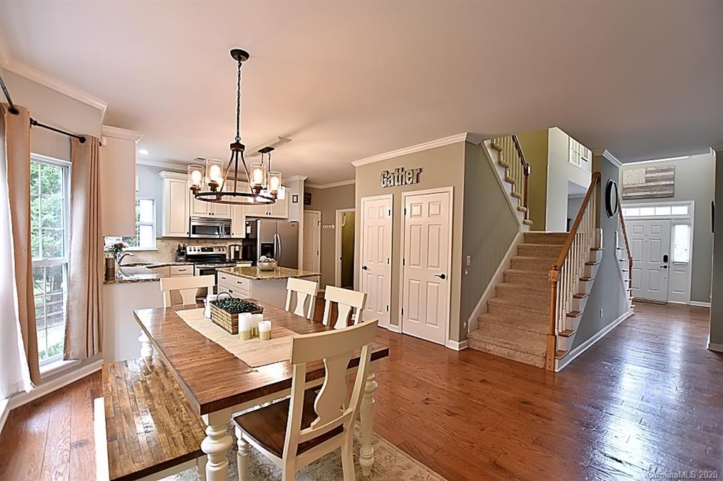 735 West Cheval Drive Fort Mill, SC 29708 - Photo 15 of 41 a view of a dining room with furniture window and wooden floor