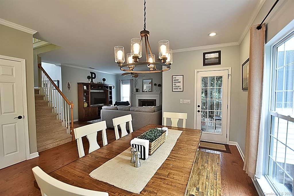 735 West Cheval Drive Fort Mill, SC 29708 - Photo 16 of 41 a living room with furniture a chandelier and wooden floor