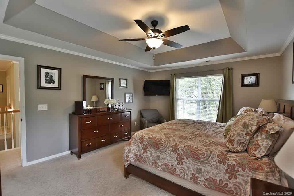 735 West Cheval Drive Fort Mill, SC 29708 - Photo 18 of 41 a bedroom with a bed and a window