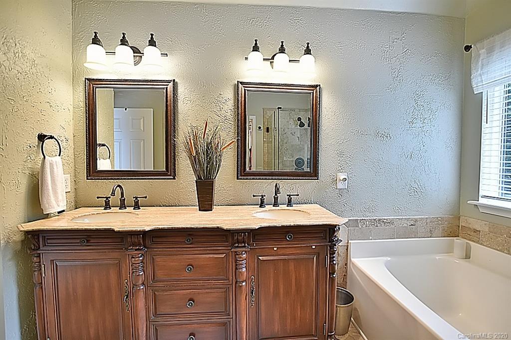 735 West Cheval Drive Fort Mill, SC 29708 - Photo 19 of 41 a bathroom with a sink and a mirror