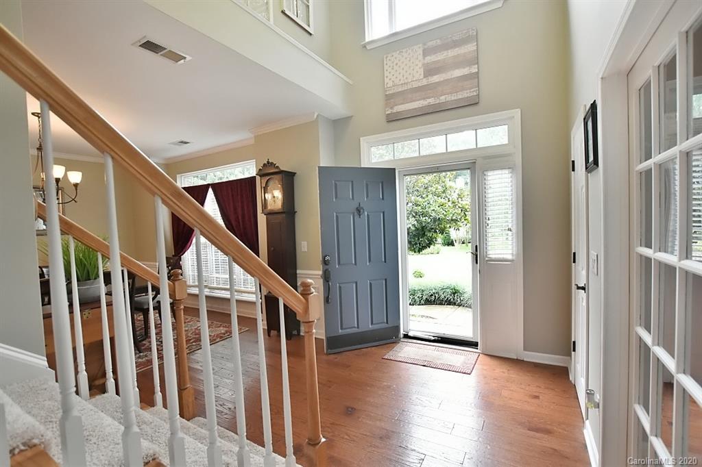 735 West Cheval Drive Fort Mill, SC 29708 - Photo 3 of 41 a view of an entryway with wooden floor and windows